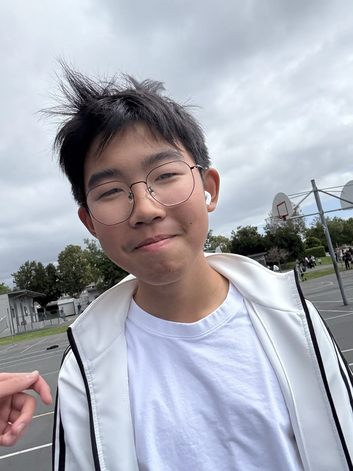 An outdoor portrait under a cloudy sky