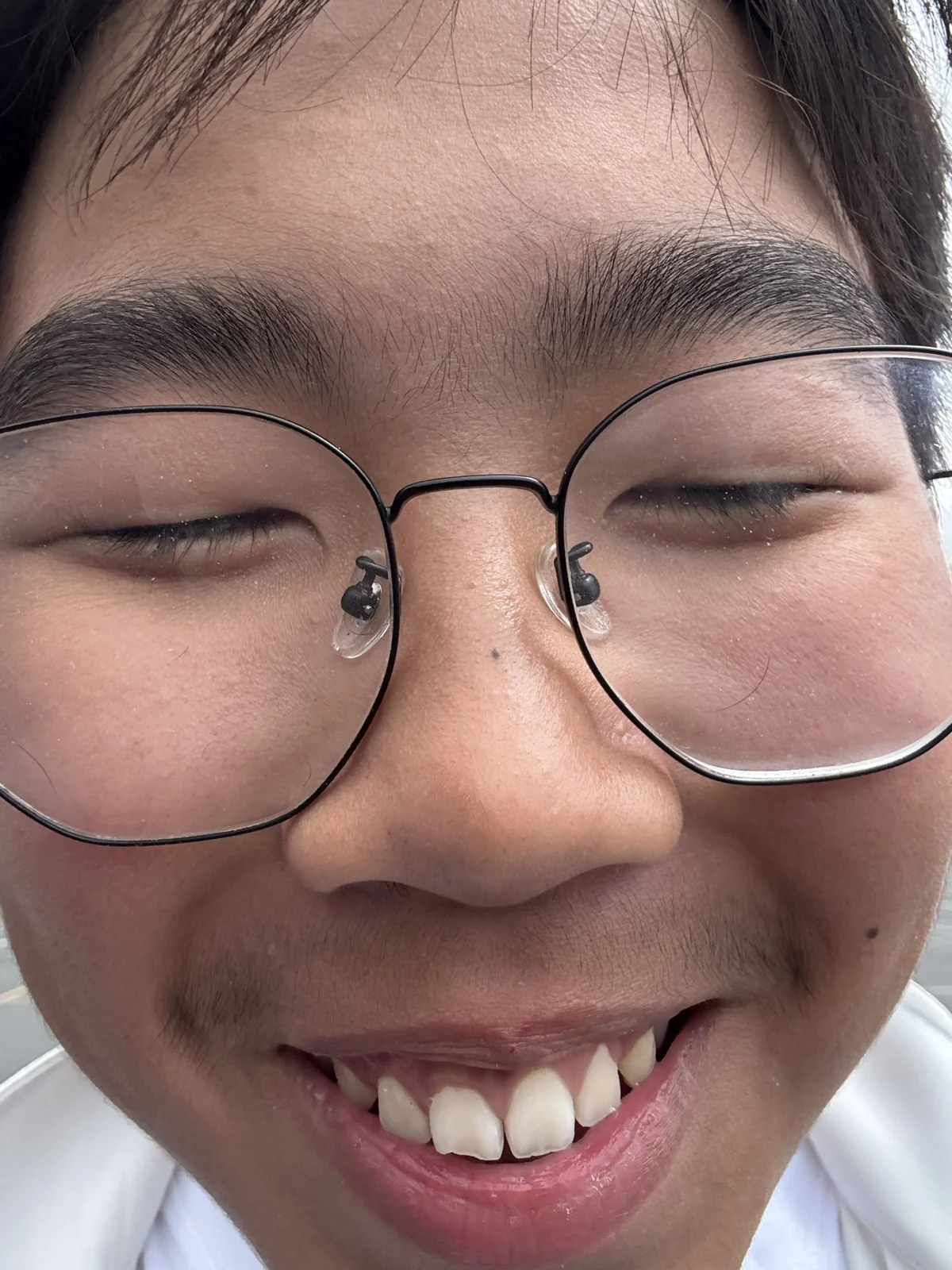 A cheerful close-up with glasses