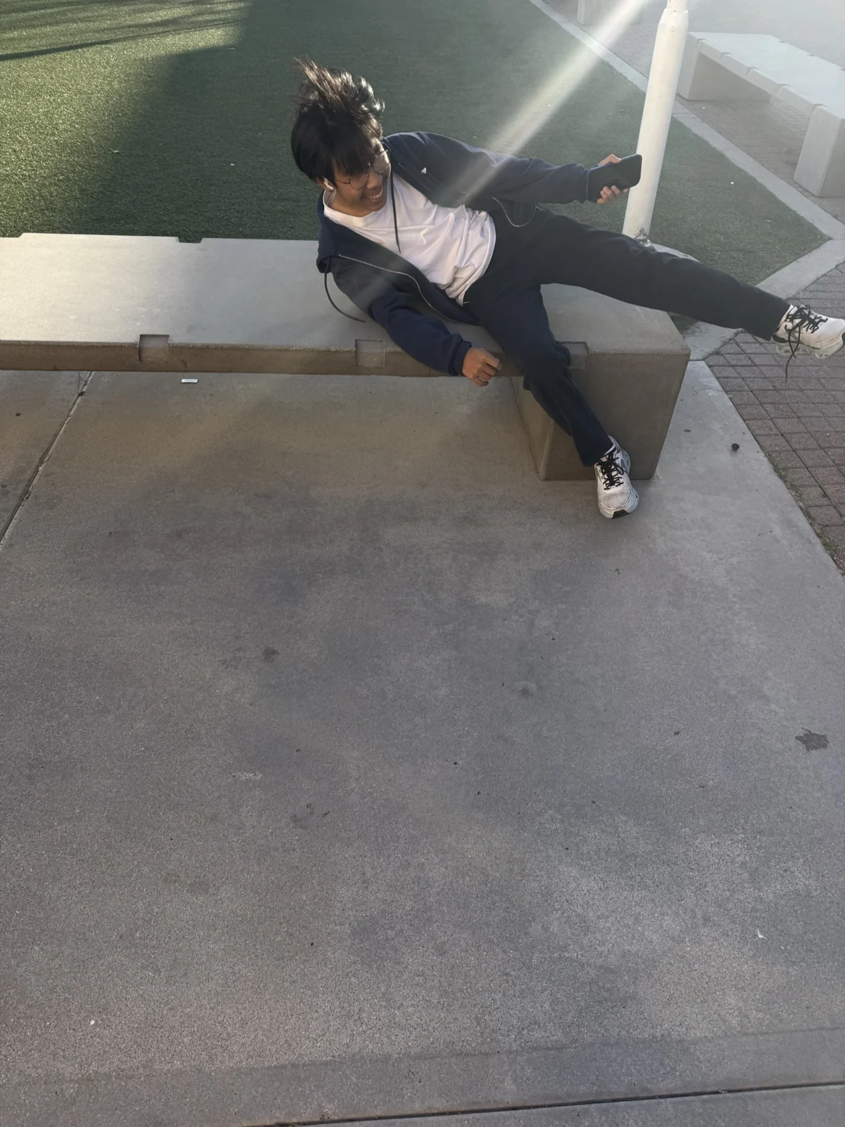 A playful pose on an outdoor bench