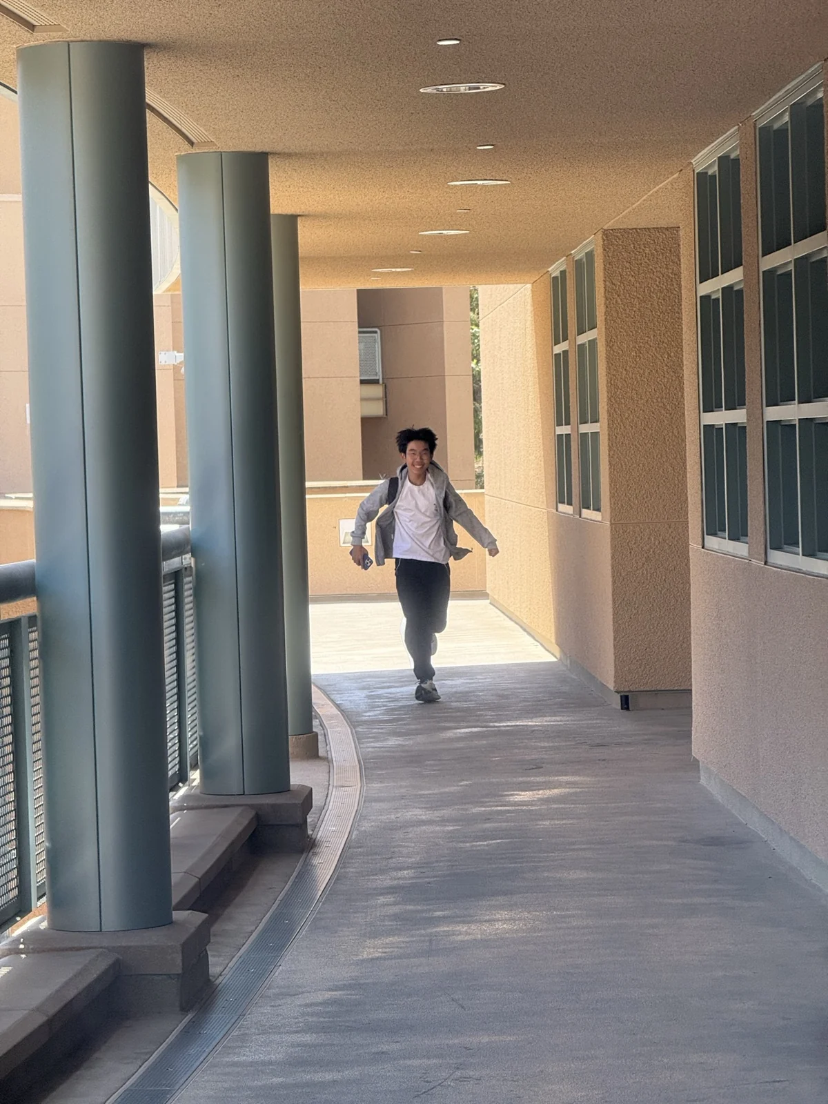 Walking along an outdoor hallway